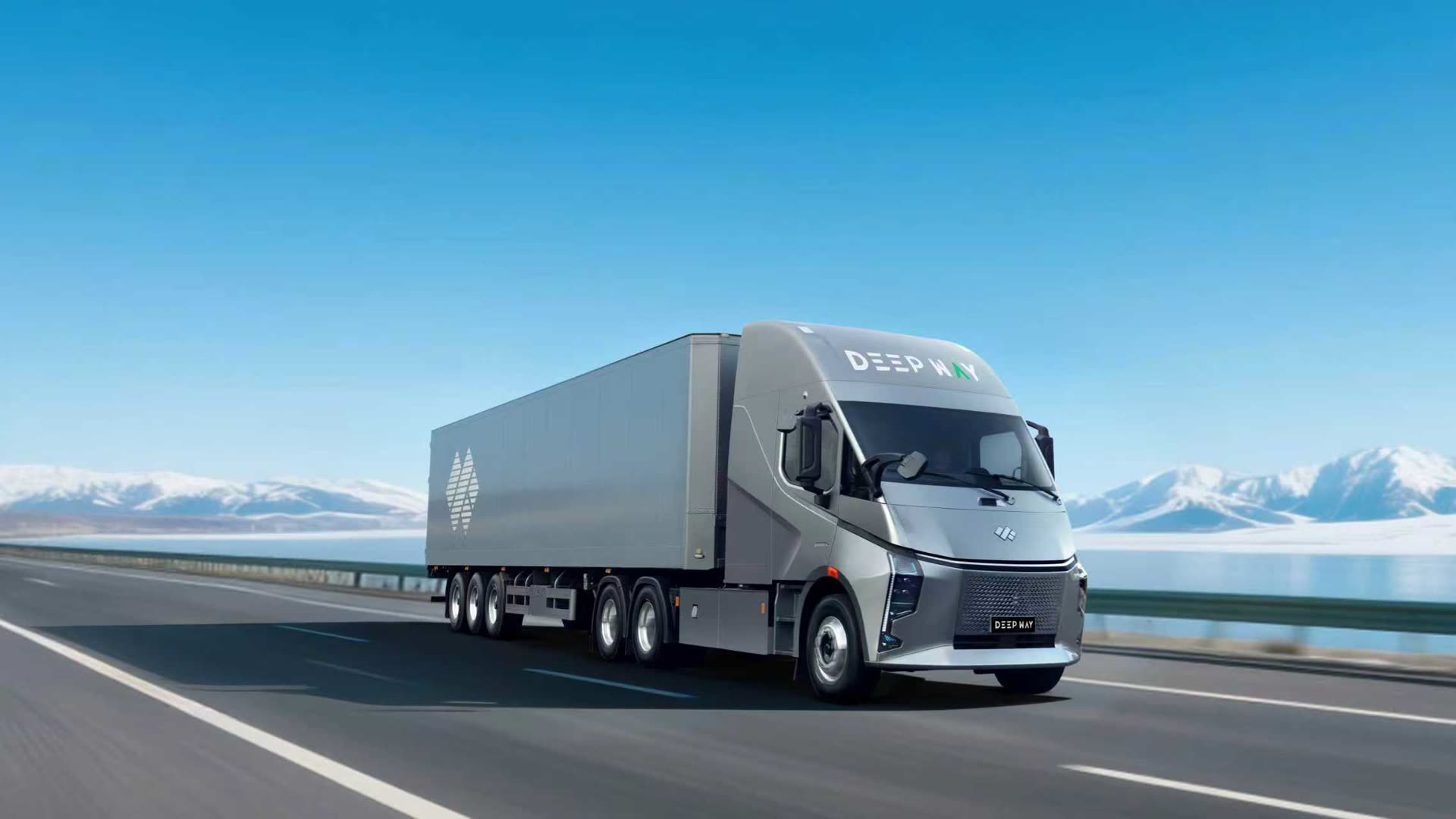 A silver Deepway Star electric prime mover hauling a trailer along a lakeside highway